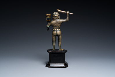 A rare bronze 'wild man' candlestick, Flanders or Germany, 15/16th C.