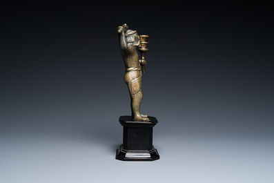 A rare bronze 'wild man' candlestick, Flanders or Germany, 15/16th C.