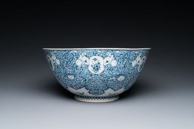 A very fine and rare Dutch Delft blue and white bowl with grotesques in the style of Daniel Marot, dated 1720
