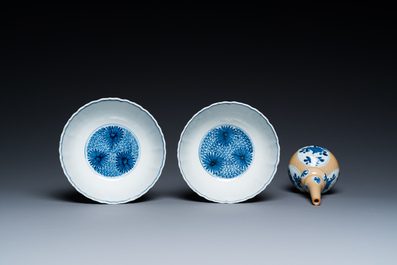 Two Chinese blue and white bowls, a small plate and a caf&eacute;-au-lait ground sprinkler, Kangxi