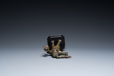 A rare bronze 'wild man' candlestick, Flanders or Germany, 15/16th C.