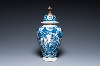 Two Dutch Delft blue and white chinoiserie vases and a deep salad bowl, 17/18th C.