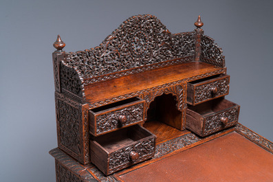 A colonial Anglo-Indian reticulated wooden desk with hidden compartment, 19th C.