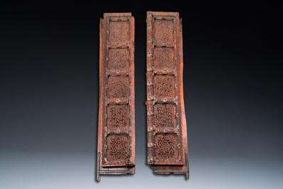 A pair of reticulated wooden doors with geometrical patterns, Northern Africa, 19th C.