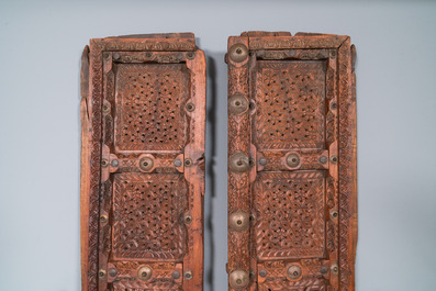 A pair of reticulated wooden doors with geometrical patterns, Northern Africa, 19th C.