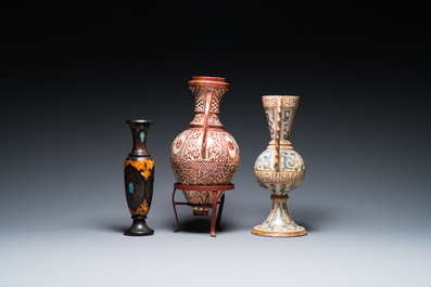 Two Hispano-Moresque lustre-glazed 'Alhambra' vases and a stone-inlaid wooden vase, Spain and Northern Africa, 19/20th C.