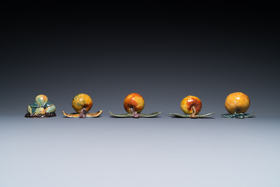 Four polychrome Dutch Delft hanging models of apples and a rare table piece with apples and pears, 18th C.
