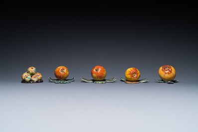 Four polychrome Dutch Delft hanging models of apples and a rare table piece with apples and pears, 18th C.