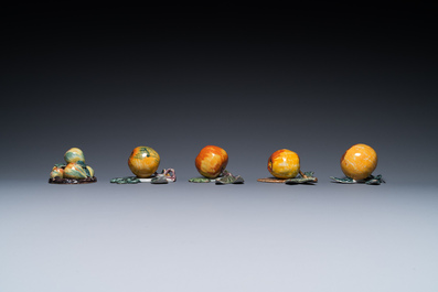 Four polychrome Dutch Delft hanging models of apples and a rare table piece with apples and pears, 18th C.