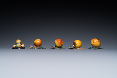 Four polychrome Dutch Delft hanging models of apples and a rare table piece with apples and pears, 18th C.