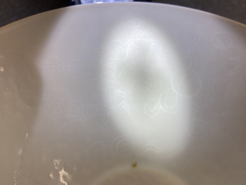 A Chinese white-glazed 'dragon' bowl with anhua design, Yongle mark, Qing