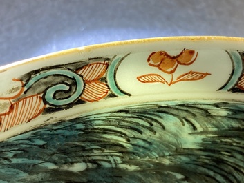 A Dutch-decorated Chinese porcelain plate with a merchant ship, Kangxi