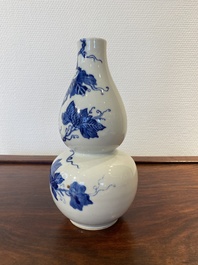 A Chinese blue and white double gourd vase, 19th C.