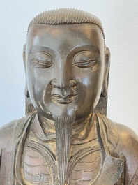 Een Chinese bronzen Zhen Wu met sporen van lakwerk, Ming