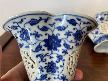 A pair of Chinese reticulated and double-walled blue and white Ming-style beakers with lotus scrolls, Qianlong