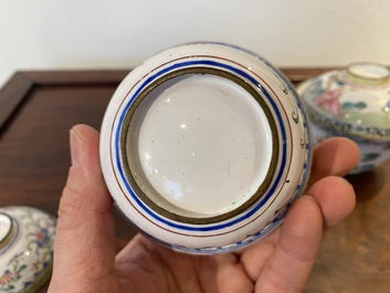 Two Chinese Canton enamel covered bowls on stands and two bowls, 18/19th C.