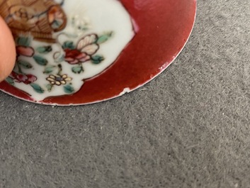 A Chinese famille rose ruby-ground cup and saucer, Yongzheng