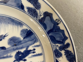 A Chinese blue and white 'Eight horses of Mu Wang' plate, Kangxi