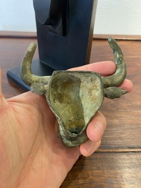 A Chinese bronze buffalo head ornament, Warring States Period