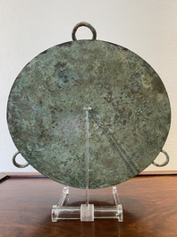 A large Chinese bronze mirror with turquoise and gold or gilt silver inlays, Warring States Period