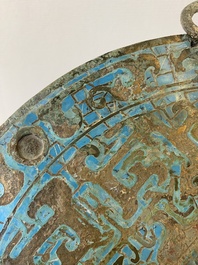 A large Chinese bronze mirror with turquoise and gold or gilt silver inlays, Warring States Period