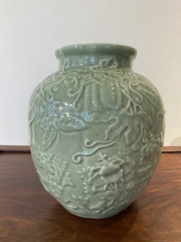 Een Chinese monochrome celadon-geglazuurde vaas met reli&euml;fdecor, 19/20e eeuw