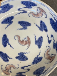 A Chinese blue, white and copper-red 'Bats and clouds' plate, Qianlong mark but probably later