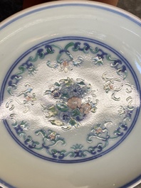 A Chinese doucai saucer with floral design, Yongzheng mark, 19/20th C.