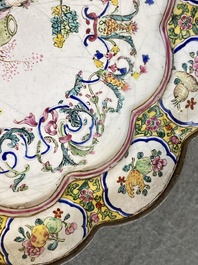 A lobed Chinese Canton enamel plate with a lady and two boys in a garden, Yongzheng