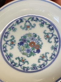 A Chinese doucai saucer with floral design, Yongzheng mark, 19/20th C.