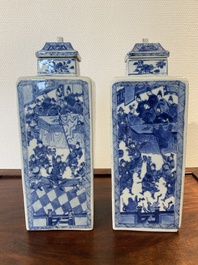 A pair of Chinese blue and white square 'narrative subject' vases and covers, Kangxi