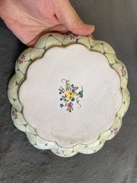 A lobed Chinese Canton enamel plate with a lady and two boys in a garden, Yongzheng