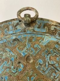 A large Chinese bronze mirror with turquoise and gold or gilt silver inlays, Warring States Period