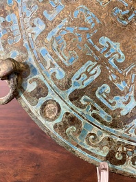 A large Chinese bronze mirror with turquoise and gold or gilt silver inlays, Warring States Period