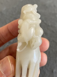 A Chinese white jade sculpture of a Buddha hand with monkeys, Qing
