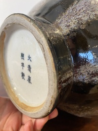 A Chinese brown-flamb&eacute;-glazed 'hu' vase, Kangxi mark, 19th C.