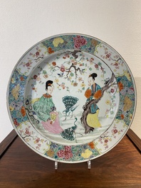 A large Chinese famille rose 'ladies and peacocks' dish, Yongzheng