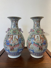 A pair of Chinese famille rose vases with elephant handles, 19th C.