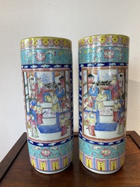 A pair of Chinese famille rose cylindrical vases, 19th C.
