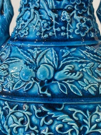 A pair of Chinese turquoise-glazed 'lotus' vases, 19th C.