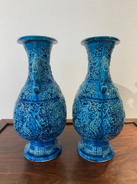 A pair of Chinese turquoise-glazed 'lotus' vases, 19th C.
