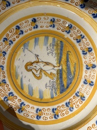 A blue, white and yellow Dutch Delft 'putto' dish, Verstraeten workshop, Haarlem, ca. 1640-1660