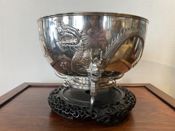 A large Chinese silver bowl resting on three dragon feet, marked for Kun He, Shanghai, 19/20th C.