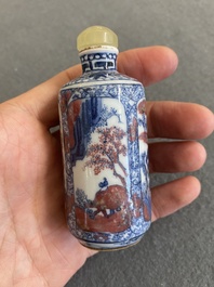 A Chinese blue, white and copper-red snuff bottle, 19th C.