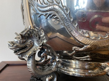 A large Chinese silver bowl resting on three dragon feet, marked for Kun He, Shanghai, 19/20th C.