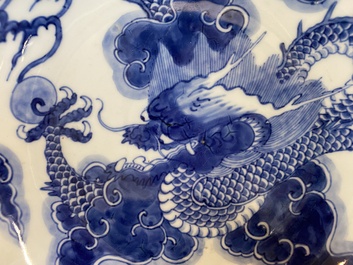 A Chinese blue and white plate with a dragon chasing the flaming pearl, Yongzheng mark and of the period