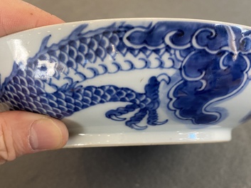 A Chinese blue and white plate with a dragon chasing the flaming pearl, Yongzheng mark and of the period