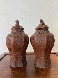 An extremely rare pair of Chinese Yixing stoneware octagonal vases and covers, Kangxi