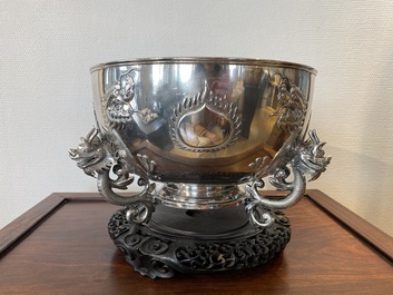 A large Chinese silver bowl resting on three dragon feet, marked for Kun He, Shanghai, 19/20th C.