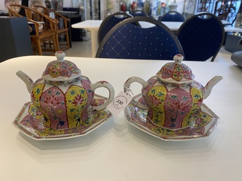 A pair of Chinese octagonal famille rose teapots on stands, Yongzheng